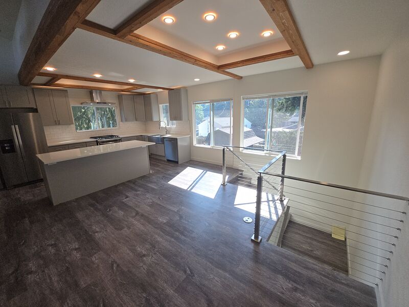 Dining area open to the kitchen with coffered wood-beam ceiling